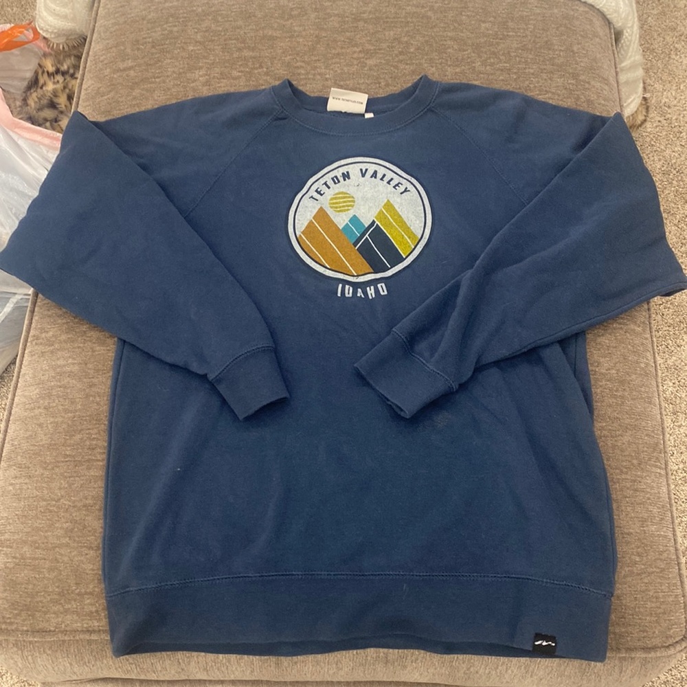 I am selling a size XL blue sweater from TECHSTYLES.